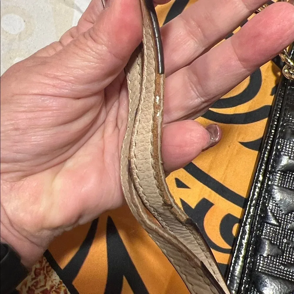 Michael Kors Jet Set Chain Tote in black patent leather with gold hardware.
